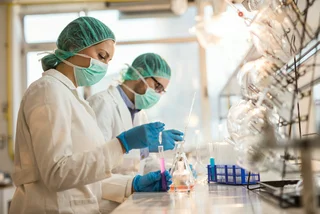 Scientists examine chemical substances in a medical research in the laboratory. (Photo: iStock, skynesher)