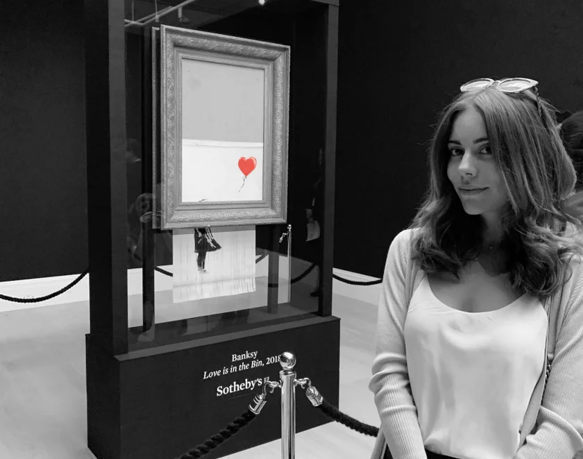 AAU alumna Aleksandra Artamonovskaja was part of the team that created the .ART registry (seen here with Banksy's Love is in the Bin at Sotheby's, London).