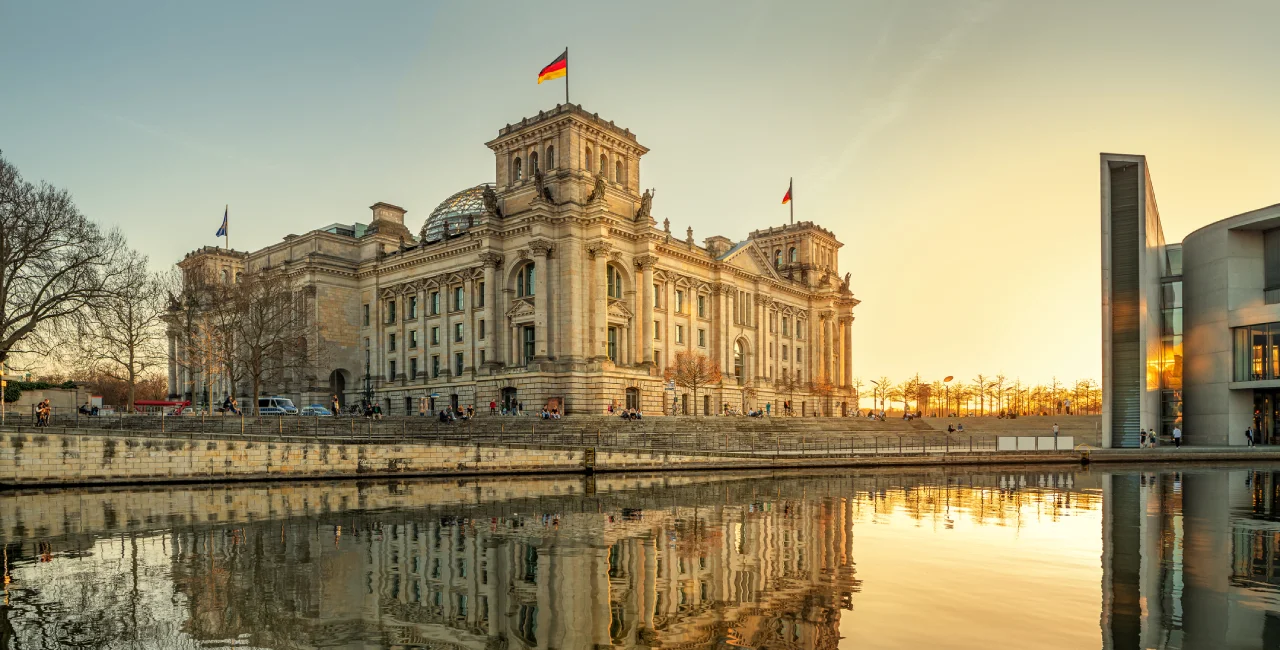 German flag atop Reichstag Building in Berlin via iStock / frankpeters