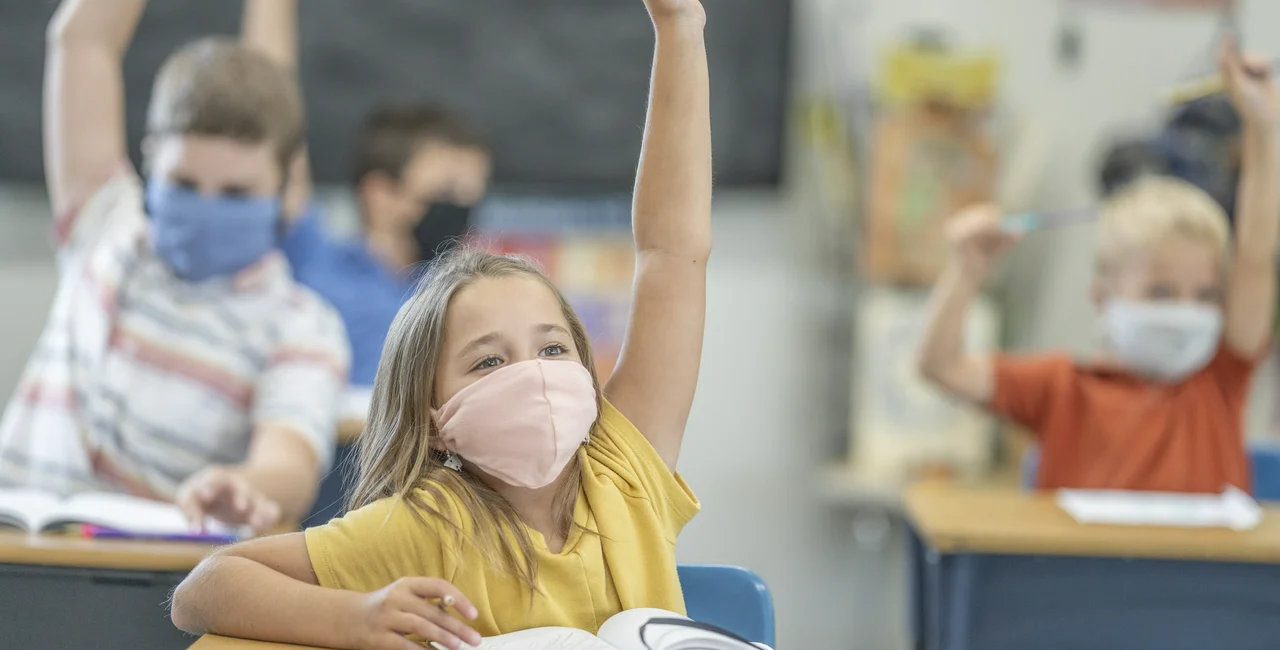 Primary school students with face masks. (Photo: iStock, FatCamera)