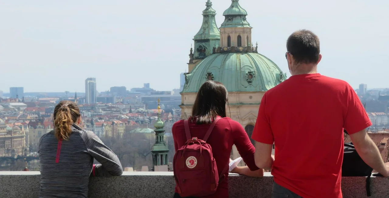 Three people look at the view from the Prague Castle Gaedens. (Photo: Raymond Johnston)