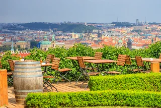 Following the reopening of shops May 10, restaurant gardens could open by May 17 at the earliest. (view of Prague's Old Town from a cafe via iStock - rustamank)