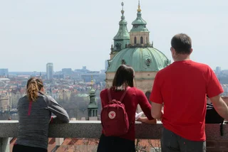 Three people look at the view from the Prague Castle Gaedens. (Photo: Raymond Johnston)