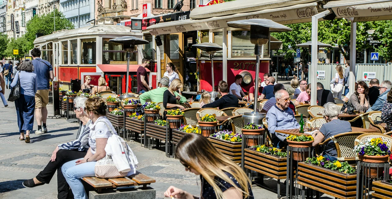 People eat at outdoor seating in Prague. (Photo: iStock, Marc Dufresne)