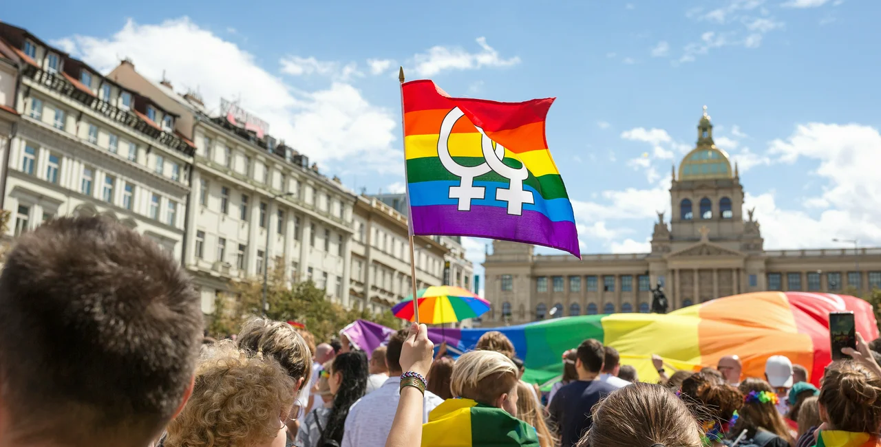 Rainbow flag at a pride parade in Prague. Photo via iStock/ Anna Chaplygina.