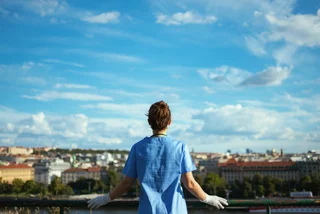 Health worker overlooks the city of Prague. Photo: iStock / CentralITAlliance