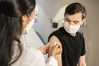 Person getting vaccinated. (Photo: Unsplash, CDC)