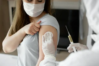 Woman getting vaccinated. (Photo: iStock, Artem Zakharov)