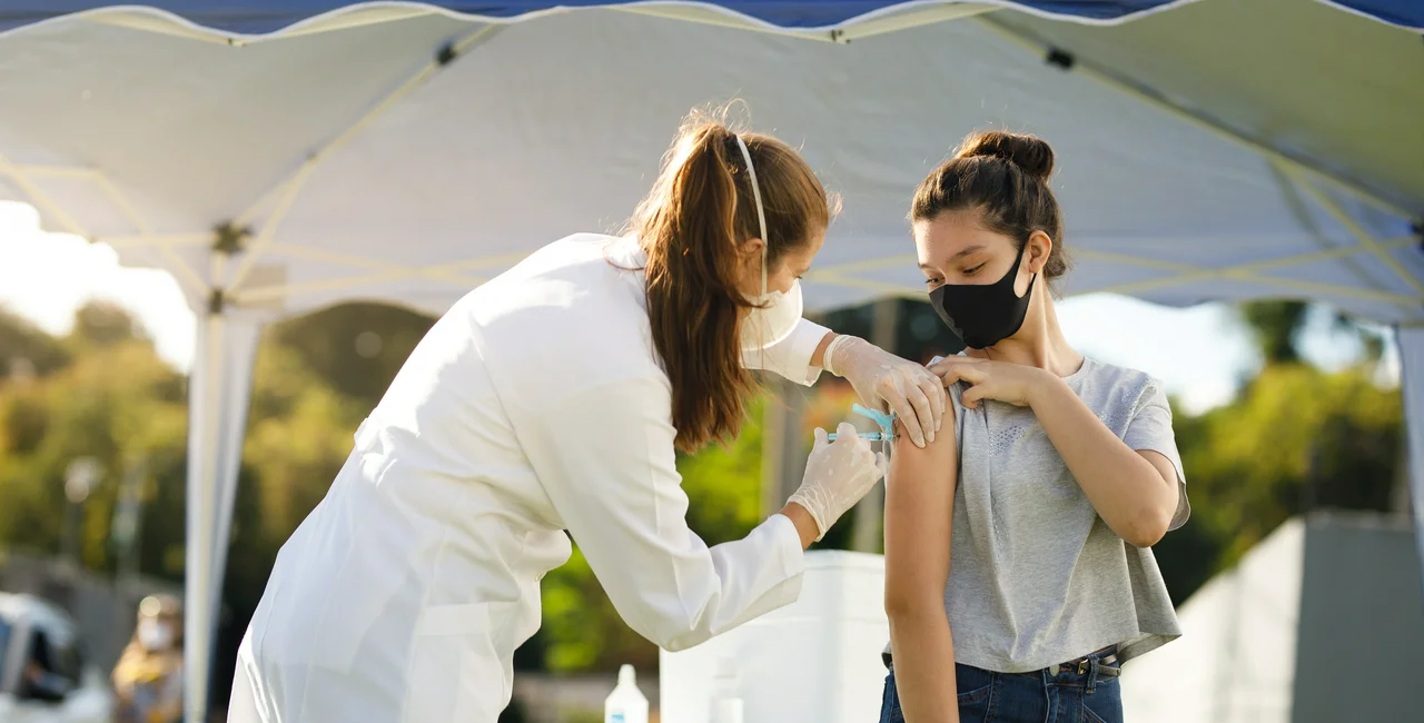 Teenage girl receiving a Covid-19 vaccine. Photo: iStock / Capuski