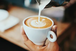 Cappuccino being poured. (Photo: Unsplash, Fahmi Fakhrudin) 