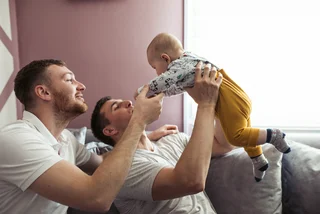 same-sex couple with a child. (Photo: iStock, lada_maestro)