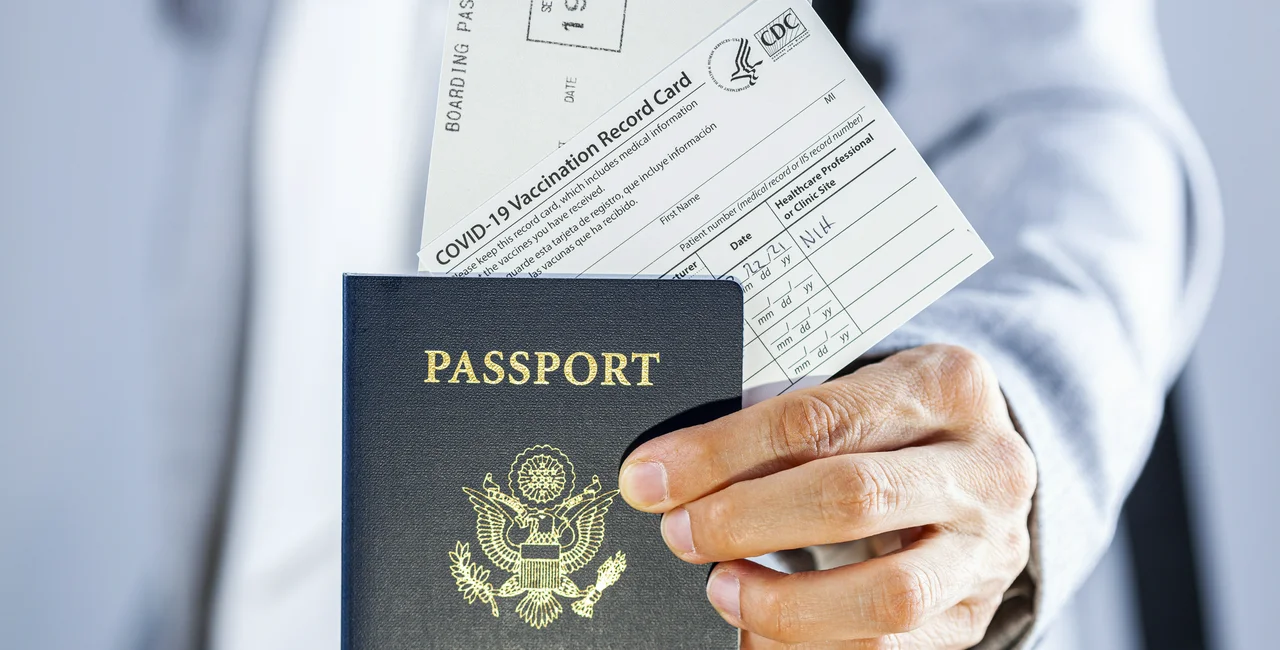 American passport with a CDC vaccination card. (Photo: iStock, Grandbrothers)