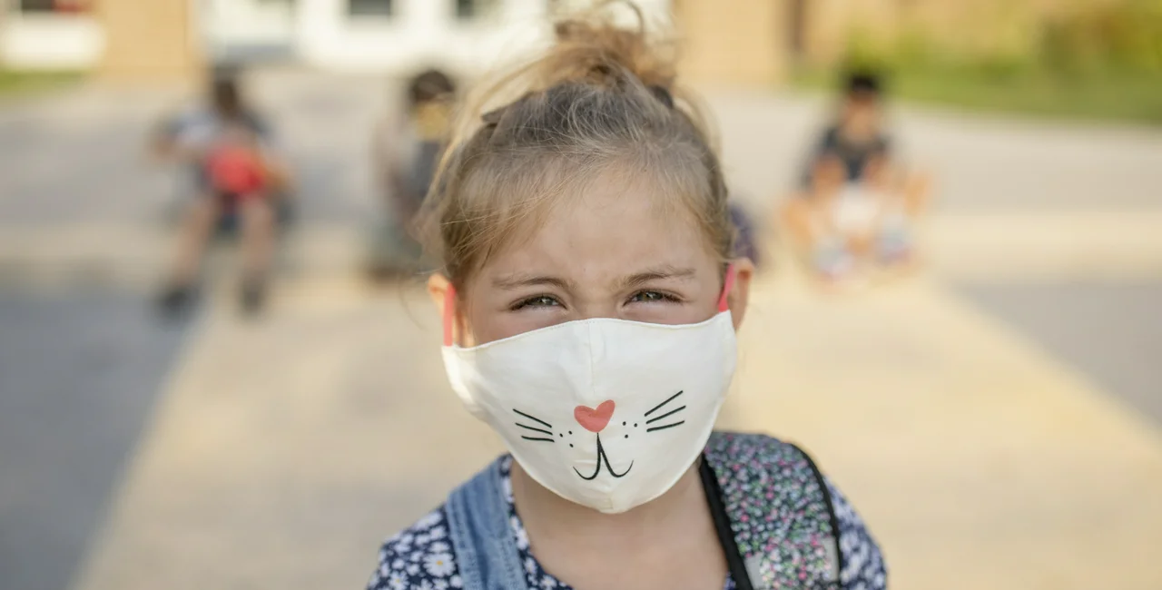 Child returning to school with a face mask. (Photo: iStock, FatCamera)