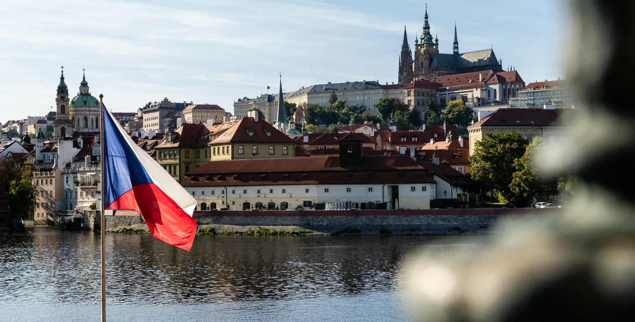 Czech flag in front of Prague Castle. Photo: iStock / Hal Gamble