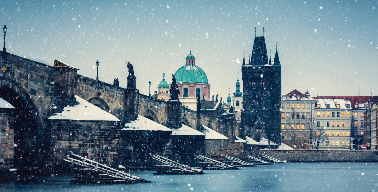 Snowfall over Prague's Charles Bridge. Photo: iStock / borchee