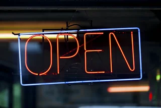 Neon opening sign. Photo: iStock / Gwengoat