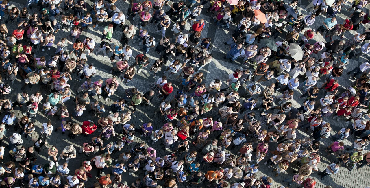 Crowd of people in Old Town Square. Photo: iStock, Grafissimo.