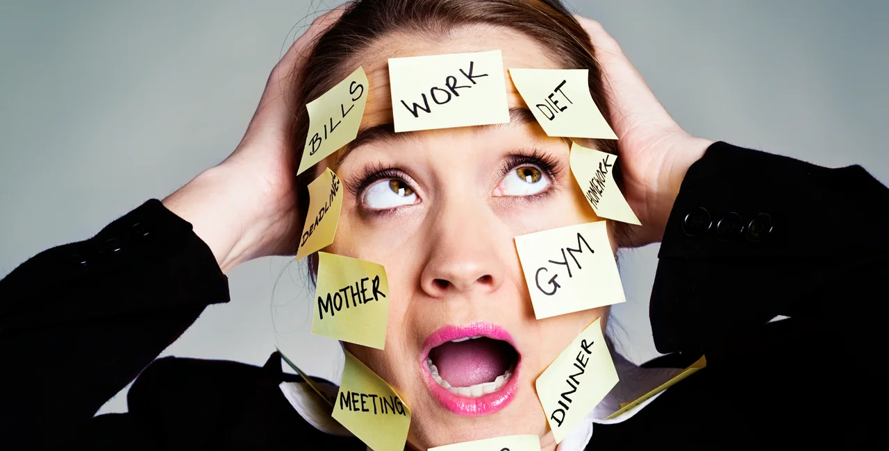 iStock-186581571 Credit RapidEye Panic as a businesswoman is overwhelmed by task reminder labels iStock