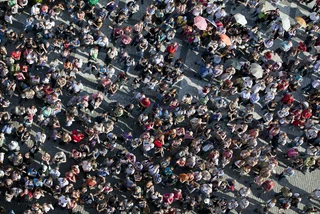 Crowd of people in Old Town Square. Photo: iStock, Grafissimo.