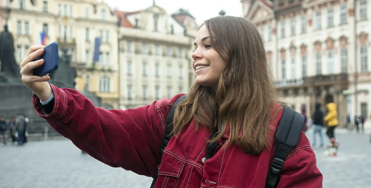 A student takes a selfie in Prague / photo via Maica