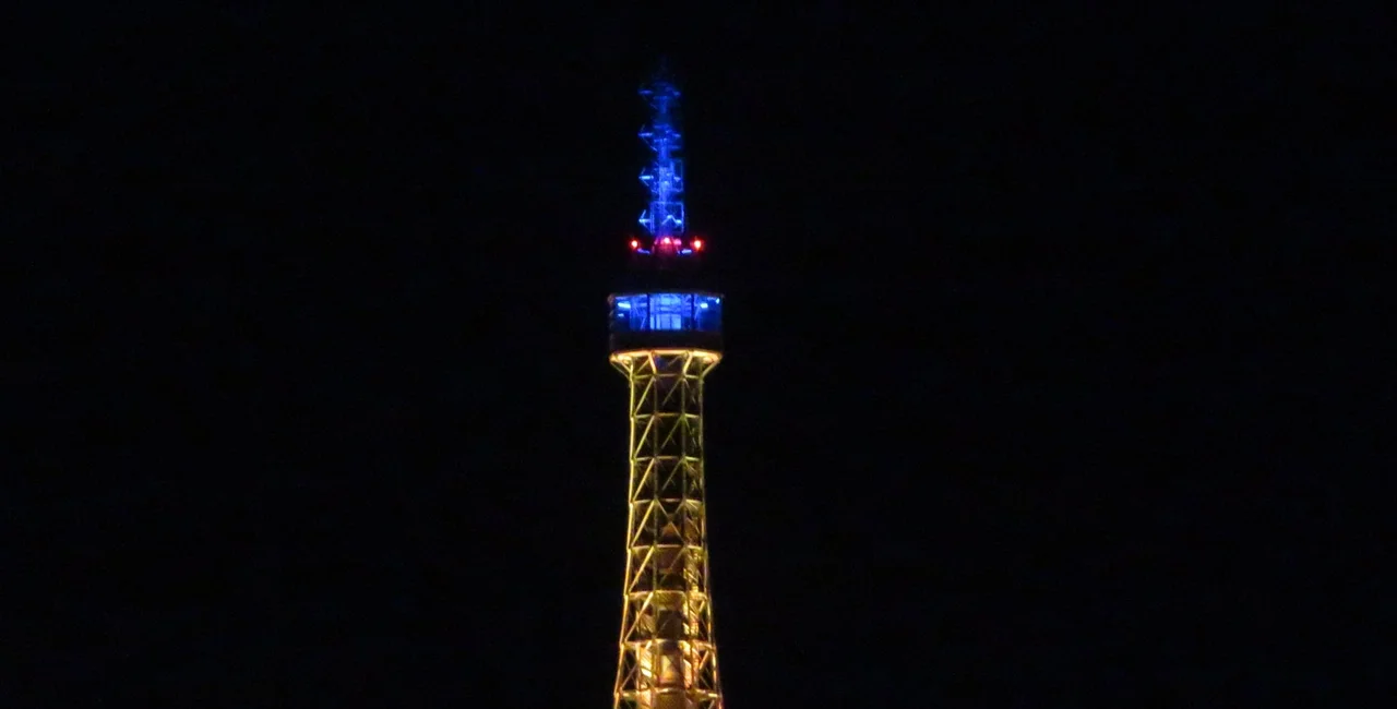 Petřín Tower lit up in blue and yellow on Tuesda in solidarity with Ukraine. Photo: Raymond Johnston