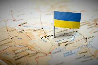 iStock-583798530  Ukraine pinned on the map with flag stock photo credit MarkRubens crop for lead