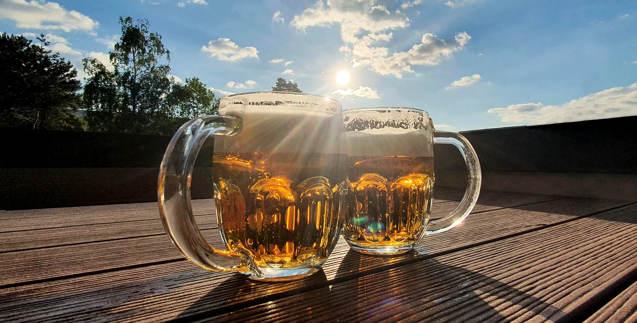 Two pints of beer at an outdoor table. Photo: iStock / Betka82