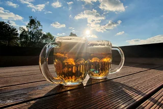 Two pints of beer at an outdoor table. Photo: iStock / Betka82