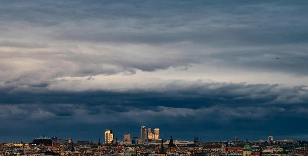 Photo of dark cloud over Prague's financial district. iStock: Jan Nevidal