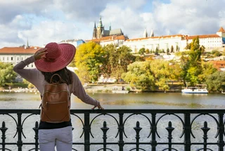 A woman takes in the view of Prague Castle. Photo: iStock, SHansche,