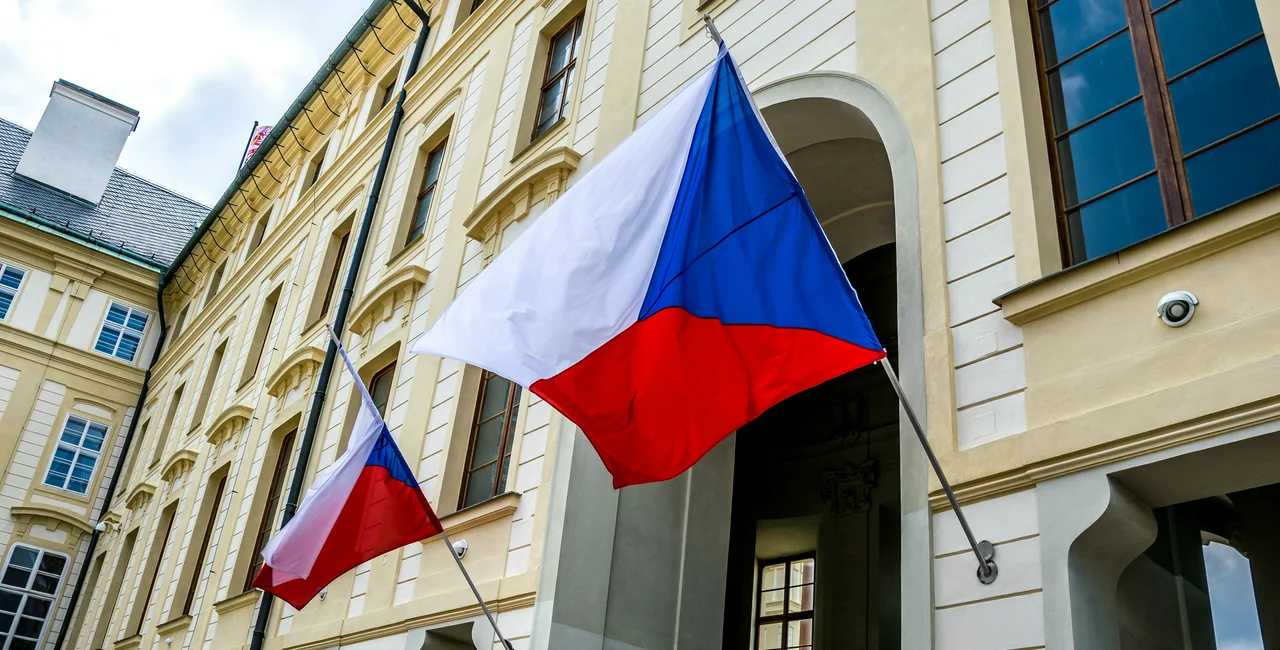 State flags of the Czech Republic on the facade of a government building in Prague. Photo: iStock /