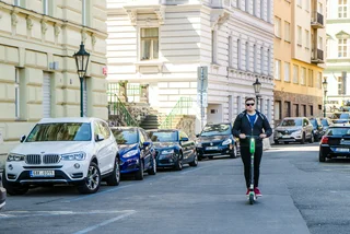 Man riding an electric scooter in Prague. Photo: iStock / Marc Dufresne
