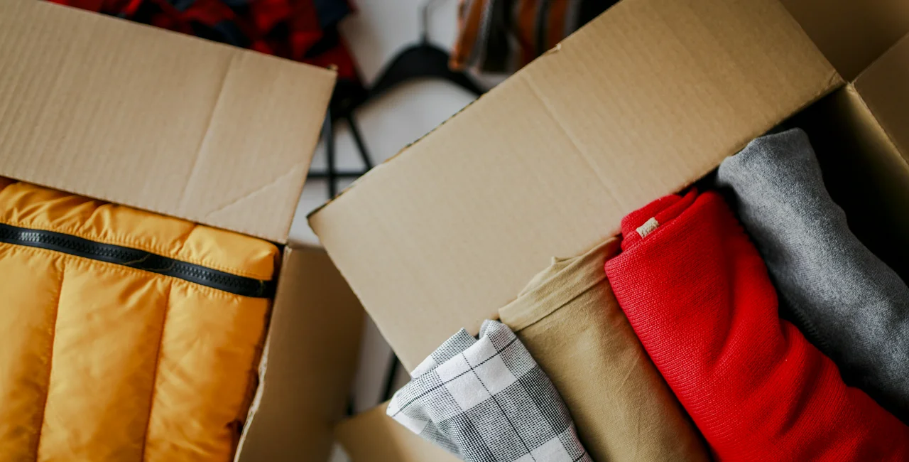 Boxes with donated clothes. Photo: iStock / DjordjeDjurdjevic