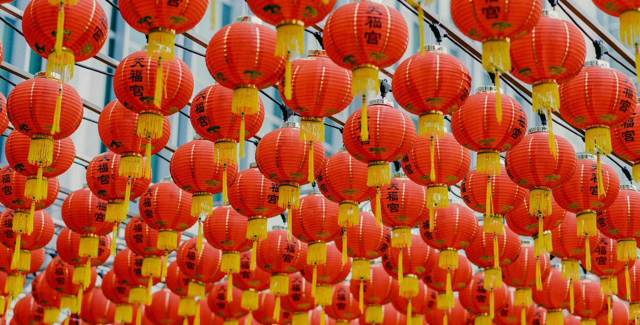 Hanging lanterns for the Chinese New Year. Photo: Unsplash / bady abbas
