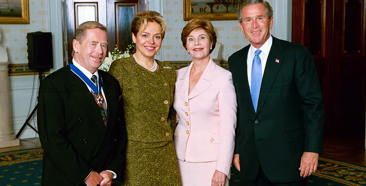 U.S. President George W. Bush and Mrs. Laura Bush stand with Medal of Freedom recipient Vaclav Havel, former president of the Czech Republic, and his wife Dagmar Havlova in the Blue Room of the White House. Photo public domain.