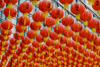 Hanging lanterns for the Chinese New Year. Photo: Unsplash / bady abbas