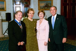 U.S. President George W. Bush and Mrs. Laura Bush stand with Medal of Freedom recipient Vaclav Havel, former president of the Czech Republic, and his wife Dagmar Havlova in the Blue Room of the White House. Photo public domain.