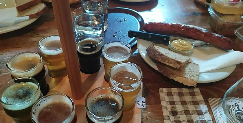 Beer and sausages at taproom Photo: Raymond Johnston.