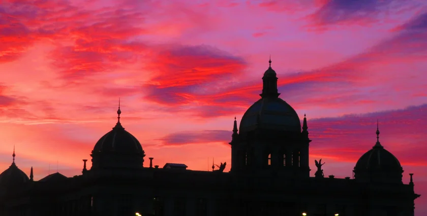 Jan. 1 sunset seen over the National Museum. Photo: Raymond Johnston