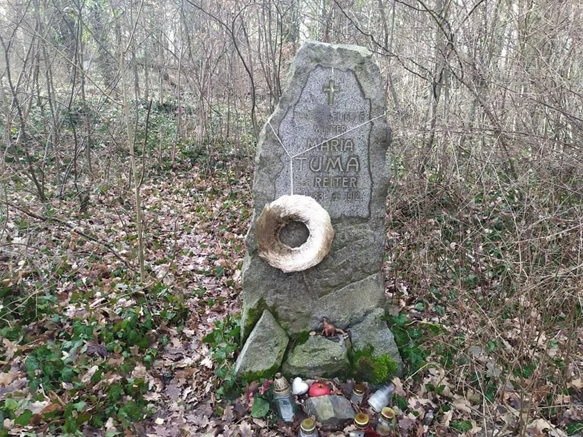Headstone with remnants of a wreath. Photo: Raymond Johnston