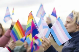 Illustrative image: Trans and LQBTQ+ flags via iStock - Vladimir Vladimirov