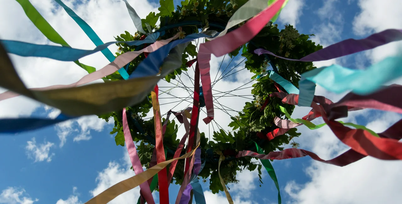 Illustrative image of a maypole - iStock/oleksii_zavodov