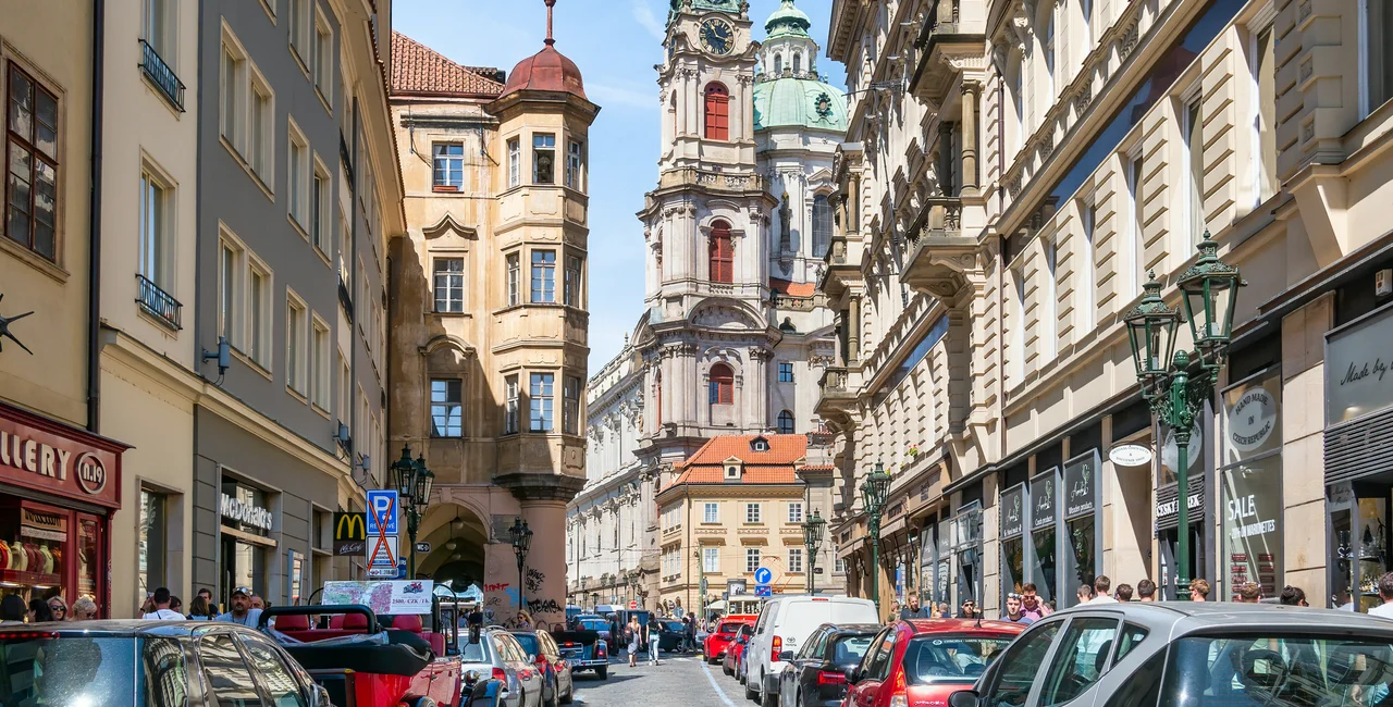 View from the streets of old town with St Nicholas Bell Tower in Prague (iStock - Cristi Croitoru)