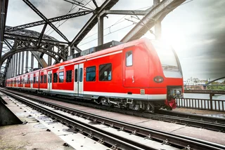 Passenger Train passing on a bridge in Frankfurt, Germany / iStock - LeoPatrizi