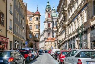 View from the streets of old town with St Nicholas Bell Tower in Prague (iStock - Cristi Croitoru)