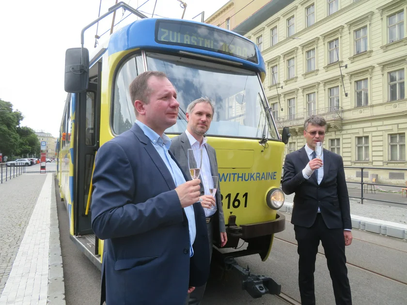 Vitaliy Usatyi, Zdeněk Hřib, and Jan Šurovský toast the tram. Photo: Raymond Johnston