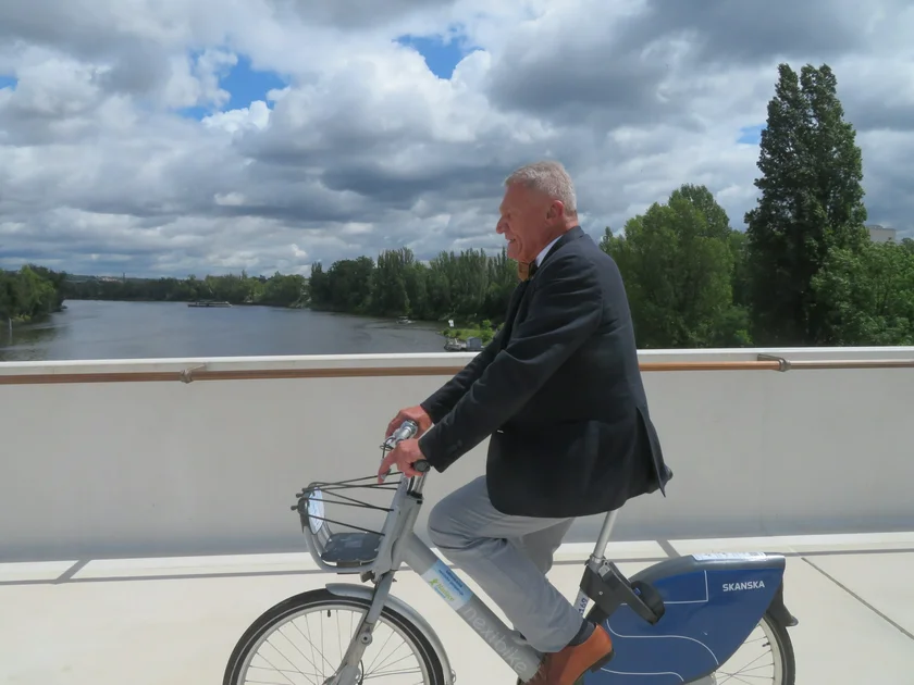 Prague Mayor Bohuslav Svoboda rides across the bridge. Photo: Raymond Johnston