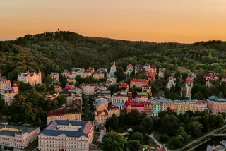 Photo via iStock by aluxum, Karlovy Vary SPA town view