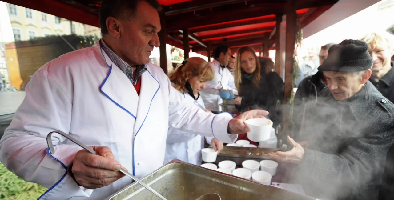 Prague Mayor serves Christmas soup at Old Town Square