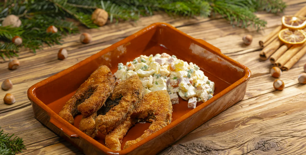Fried carp and potato salad. Photo: iStock / phbcz
